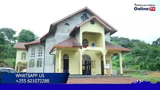 TAZAMA MHA. ASKOFU LUDOVICK J. MINDE ALIVYO PIGA JEMBE KUFUNGUA UJENZI WA NYUMBA YA MAPADRE CHOMBO