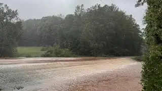 Glassy road in Tigerville, South Carolina flooding