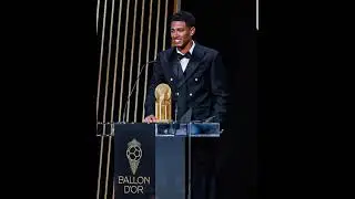 Jude Bellingham with his mom, dad & award