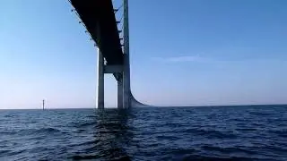Sailing under bridge between Copenhagen and Malmoe -