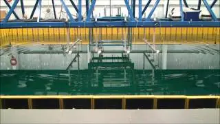 Time reversal of water waves in a wave tank