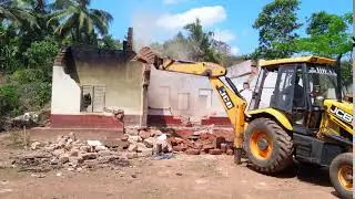JCB Demolishing The Outside Wall of a house