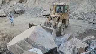 Caterpillar 966E Wheel Loader Moving Big Rocks: Roaring to Show the Power