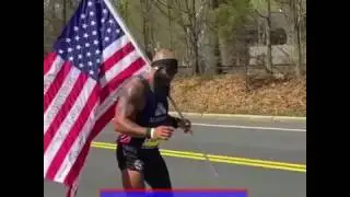 Boston Marathon: Man with fake leg runs Marathon carrying American Flag. Retired Marine Jose Sanchez