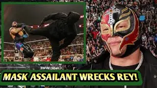 A MASKED ATTACKER AMBUSHES REY MYSTERIO DURING A WILD BRAWL WITH LOGAN PAUL ON RAW.