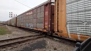 Canadian national eastbound 274 2242+BNSF 4164 in durand michigan April 24 2021.