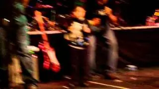 Noah Bear performing with Ozomatli