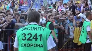 Security on a soccer match. Football steward secures fan zone from players. Stock Footage