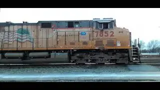 NS 154 AT GREENVILLE LEAD BY A UP C45ACTTE OR ES45AC 7852 DURING CREW CHANGE. (5)