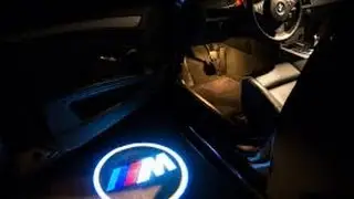 Custom LED Hologram logo vehicle lights reviewed   BMW led puddle lights shown