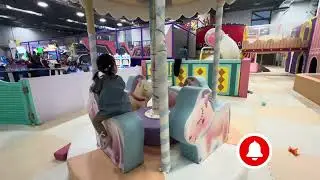 Baby Bee enjoys a magical unicorn carousel ride!