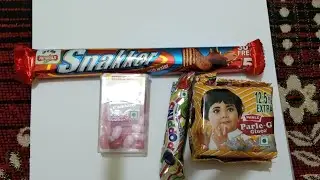 ASMR satisfying video of snakker 🍫🍬& Poppins Parle-G opening video 🍫🍬🌺🍭🥧
