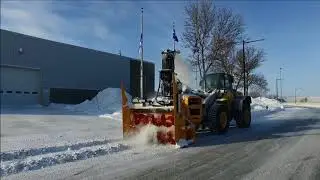 Larue D50 loader-mounted snow blower urban snow removal