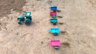 Digging heavy soil from the pit with a shovel into the tractor trolley#32