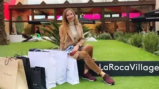 Дизайнерский аутлет La Roca Village, барселона, выбор одежды по ценам: Prada, Gucci, Burberry и т. д.