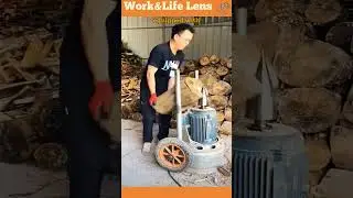 A man uses a log splitter equipped with a rotating screw cone to split logs for firewood.