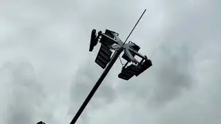 Watch as we rig the mast with a crane, grout the base, and test the powerful lights.