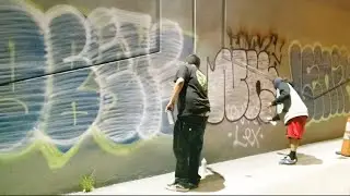 Graffiti Bombing In Skid Row At Night