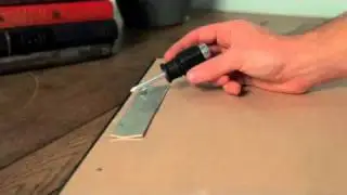 A two in one hammer and screwdriver