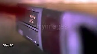 free-to-use stock footage of putting a tape into a vcr player