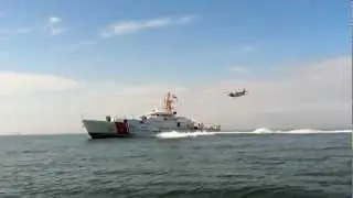 USCGC Bernard C. Webber (WPC-1101) with HC-144A flyover - starboardside