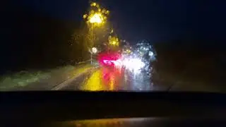Driving through laying surface water during Storm Goretti - heavy rain, spray & puddles across road