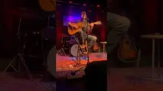 Alan Sparkman sings an original song about his parents on the Bowery Stage at the WCA.