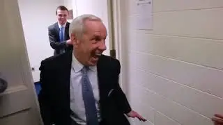 Funny College Basketball Coach walking into changing room...