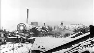 Shells exploding and bomb damaged buildings in Fraulautern, Germany, World War II HD Stock Footage