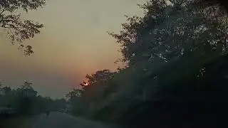 An afternoon drive enjoying the beautiful sunset and the orange sky.