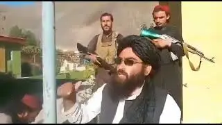 Victorious Taliban hoisting the flag of Islamic Emirate at Governor's Headquarters