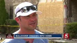 Homeowner rushes out of shower to stop bulldozer from destroying his home