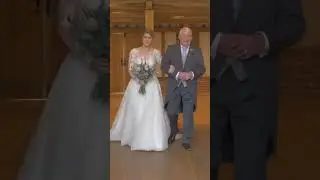 Bride walks down the aisle with her dad