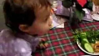 Julia eating cucumbers, Anna talking and Noi eating the Thai supper she made - 2006