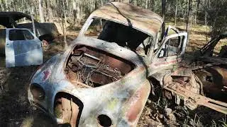 Decaying automobiles in mire. Car Cemetery (Bilkyrkog&aring;rden), Ryd, Sweden. 23.03.2022