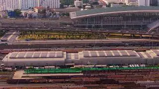 Aerial footage of Bang Sue Grand Station in Bangkok, showcasing vast railway network and bustling