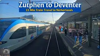 By train from Zutphen to Deventer The Netherlands through a snowy landscape 