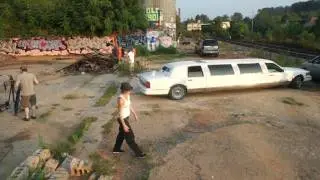 Moving a stretch limo at Trackside Gallery