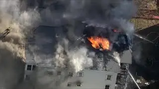Crews battle fire in triple decker in Somerville, Massachusetts