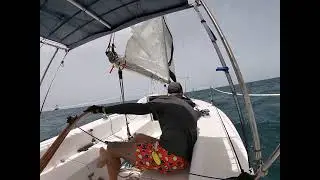 Catalina Capri 22 Arrebato, too close to the barge.  If tacking against the waves can lose momentum.
