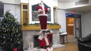 longest time to balance a 5foot santa statue on chin by someone dressed as santa clause