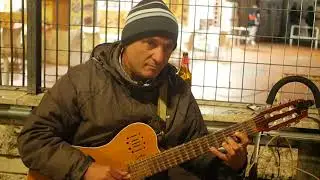 Busker play naples song with distortion Guitar
