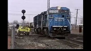 MORNING AT MARION, OHIO MAR 1996. CONRAIL, NORFOLK SOUTHERN, CSX, BOBCAT LOADS!