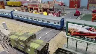 The Blue Goose passing over the crossing on the mainline.