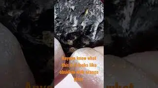 what is this Rock looks like obsidian with orange glass ? Rock video