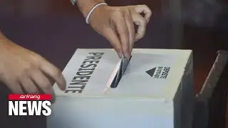 Costa Ricans head to polls, largely undecided, as runoff expected
