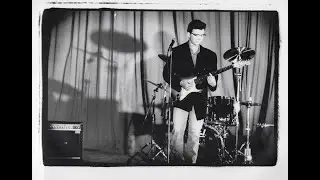 Never Gonna Give You Up but Rick looks just like Buddy Holly