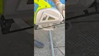 Cutting metal pipes precisely using a powerful electric saw for smooth and accurate results