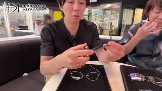 Hiromitsu Kitayama, intently choosing glasses