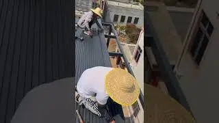 the process of installing fiberboard panels on the roof of a light steel frame building #popular